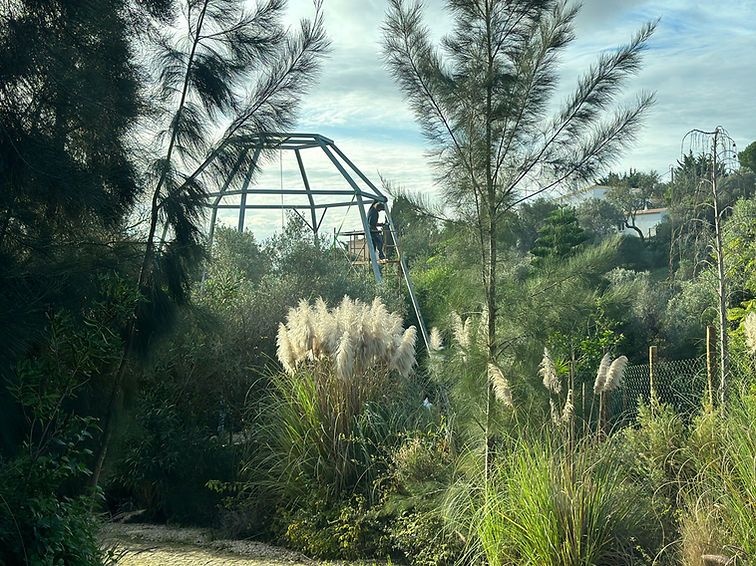 The welded steel frame of the studio in the garden