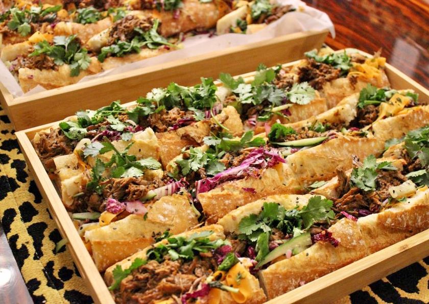 Tray of filled flatbreads with fresh herbs