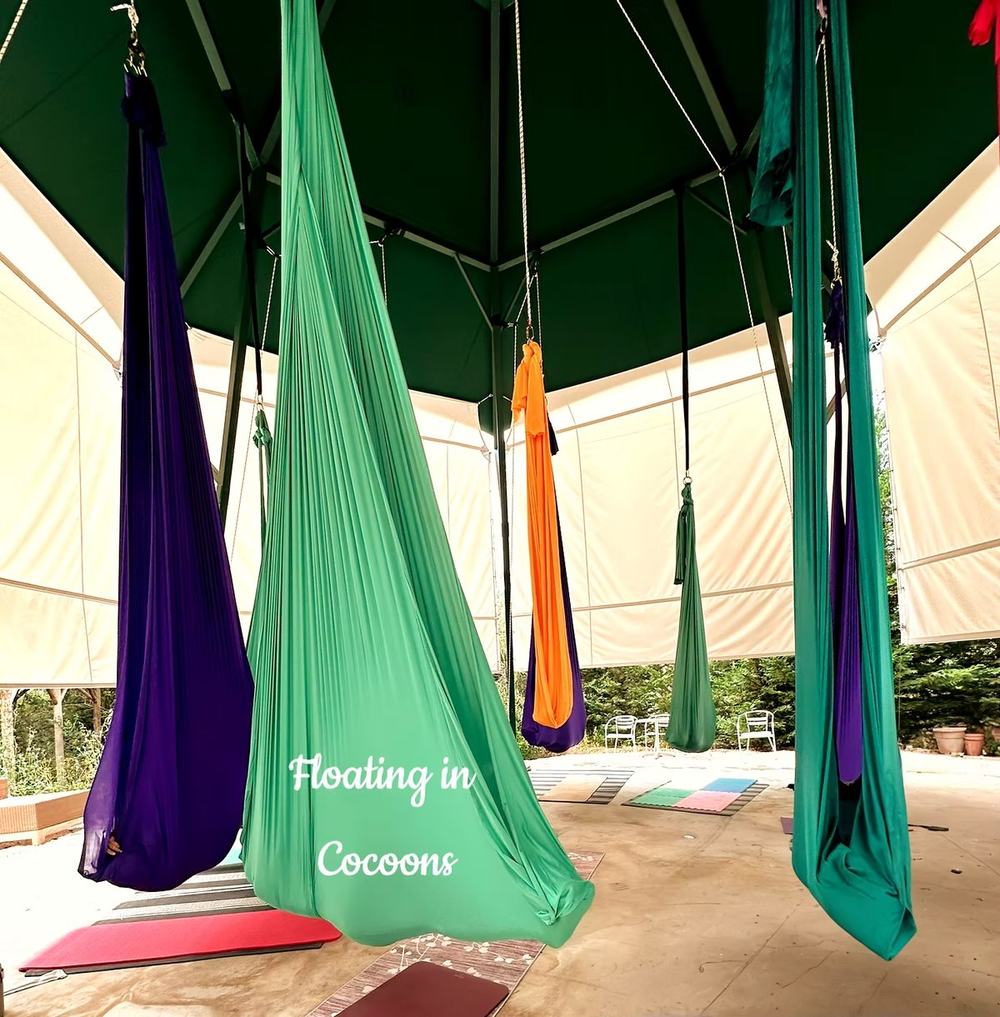 floating in cocoons during aerial yoga is one of the most relaxing parts of this practice
