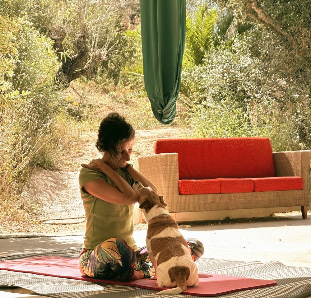 Cuddles with the studio mascot at House of Honey Aerial Yoga Retreats