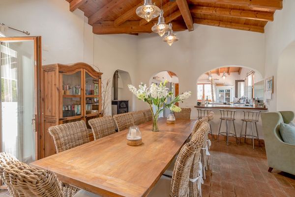 Villa dining room with a long wooden table