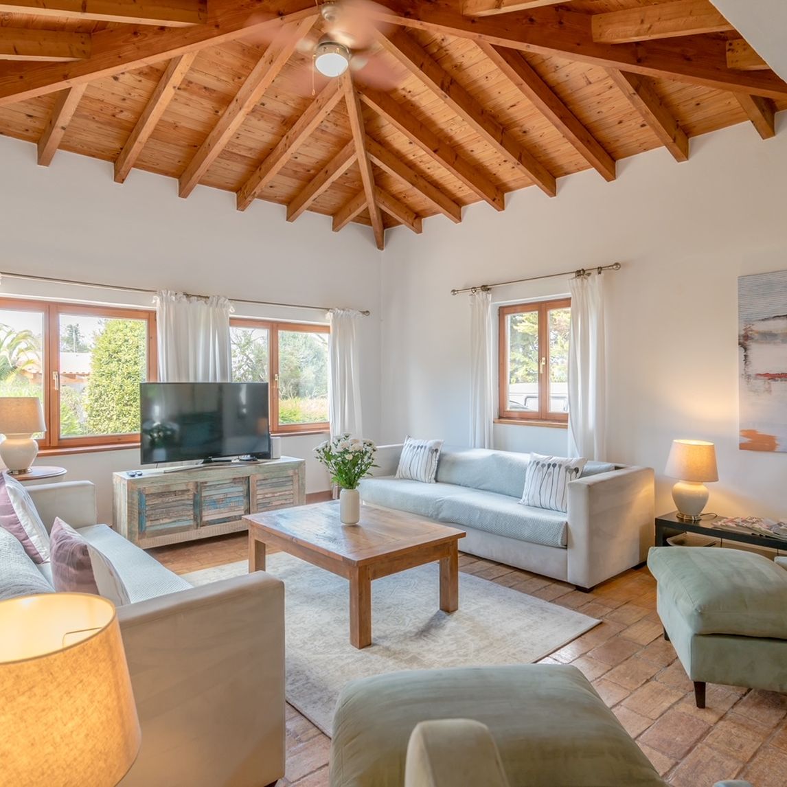 Villa living room with a wooden beamed ceiling