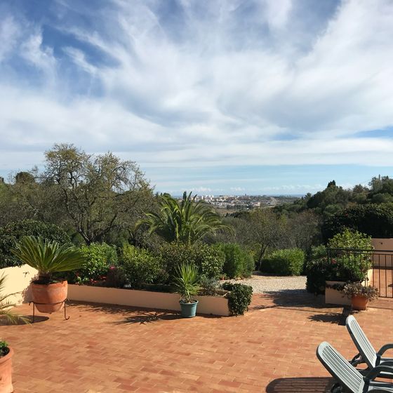 Terrace with a view over the hills to the sea
