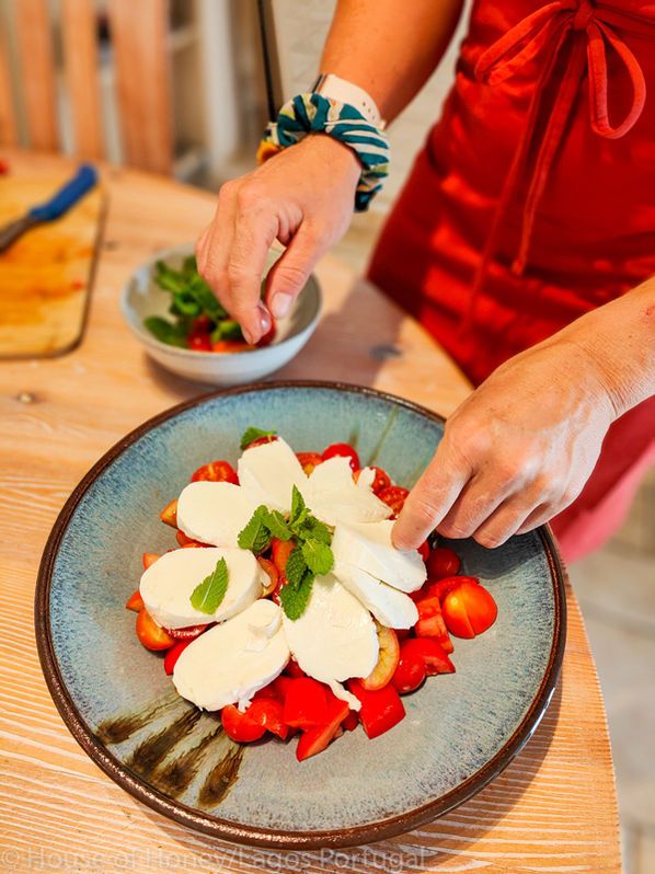 Plating a tomato and mozzarella salad