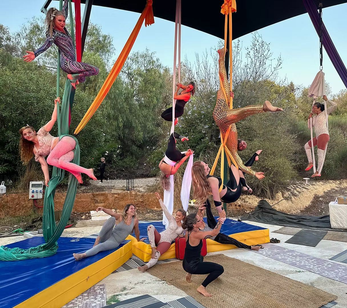 Aerialist on silks in the garden studio